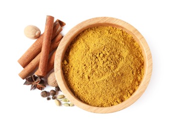 Photo of Dry curry powder in bowl and other spices isolated on white, top view