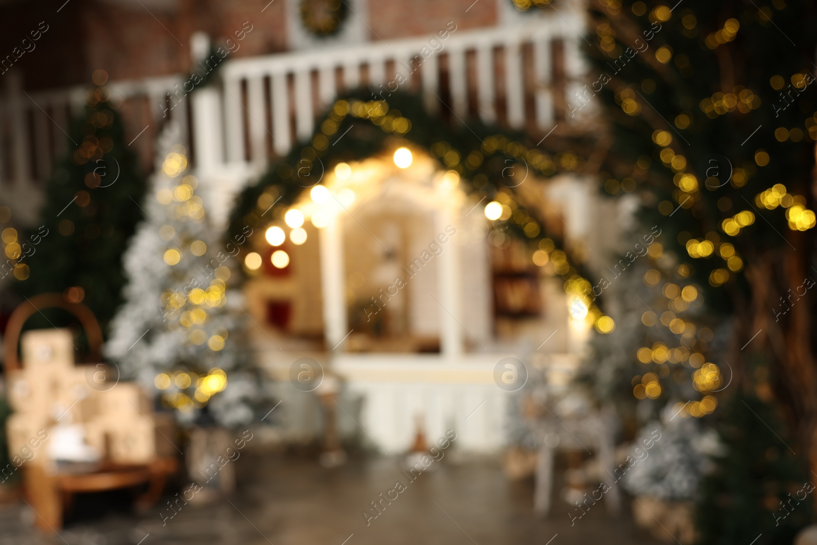 Photo of Blurred view of stylish room interior with Christmas tree and festive decor