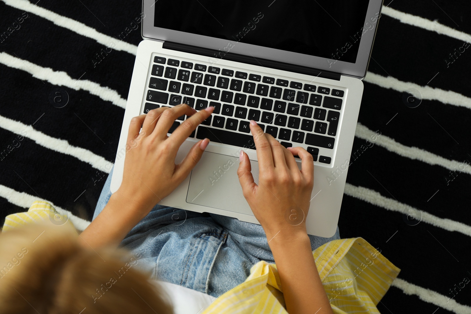 Photo of Woman working with laptop at home, closeup view