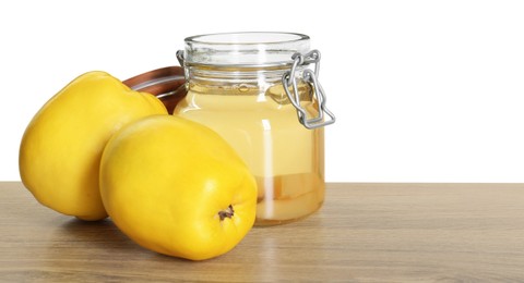 Photo of Delicious quince drink and fresh fruits on wooden table against white background