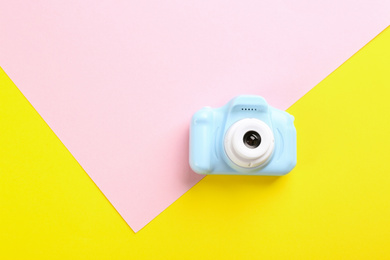 Photo of Light blue toy camera on color background, top view. Space for text