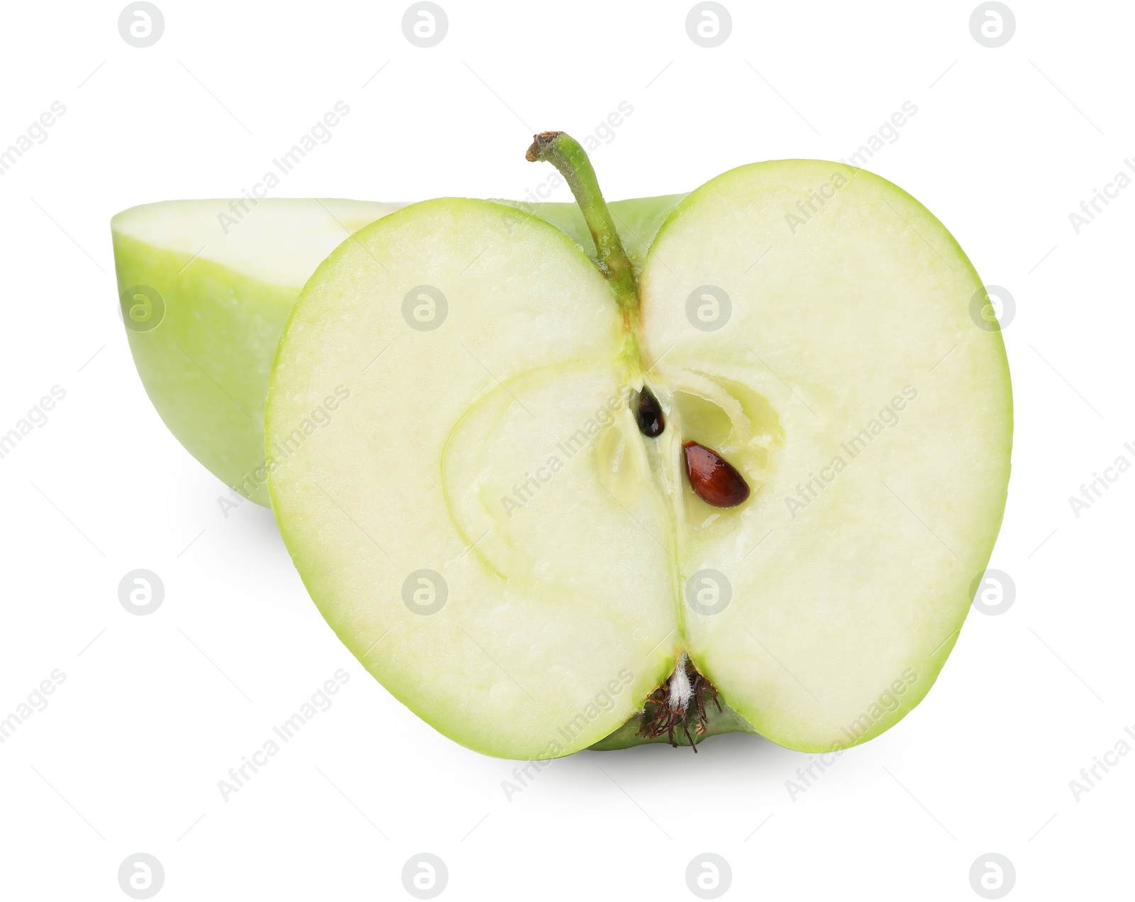 Halves of ripe green apple on white background Photo of Halves of ripe green apple on white background