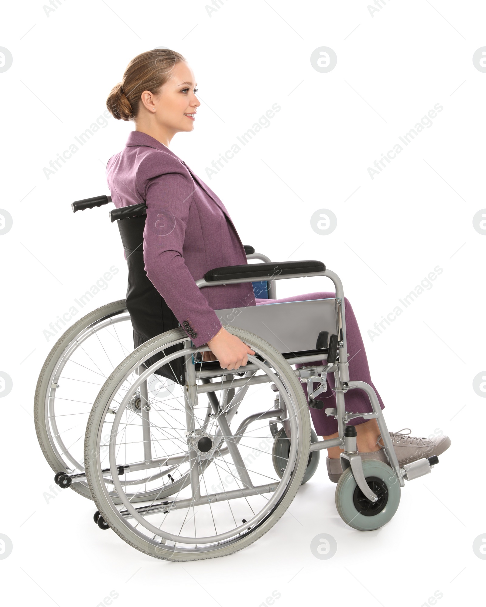 Photo of Beautiful young businesswoman in wheelchair isolated on white