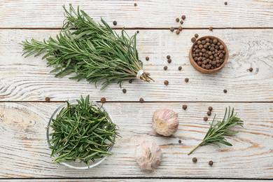 Photo of Flat lay composition with fresh rosemary on white wooden table