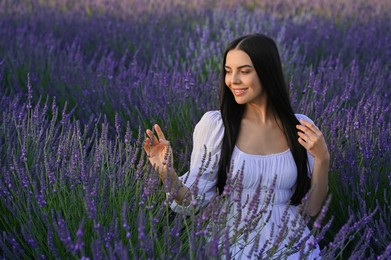 Portrait of beautiful young woman in lavender field