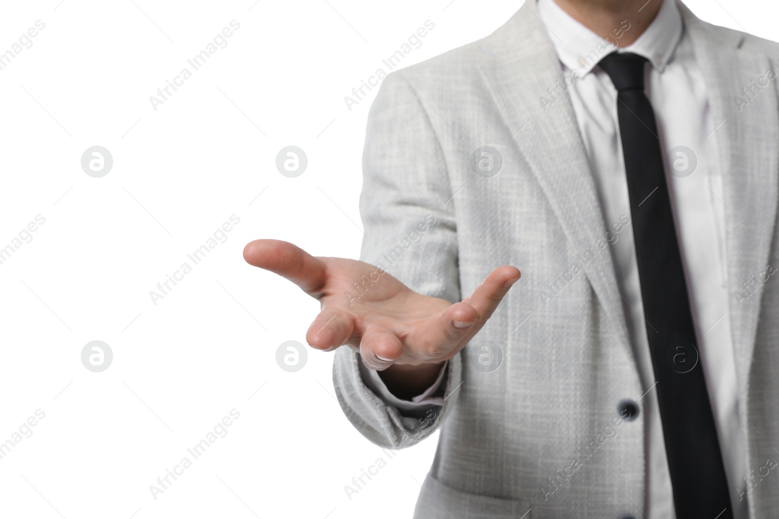 Photo of Businessman holding something on white background, closeup