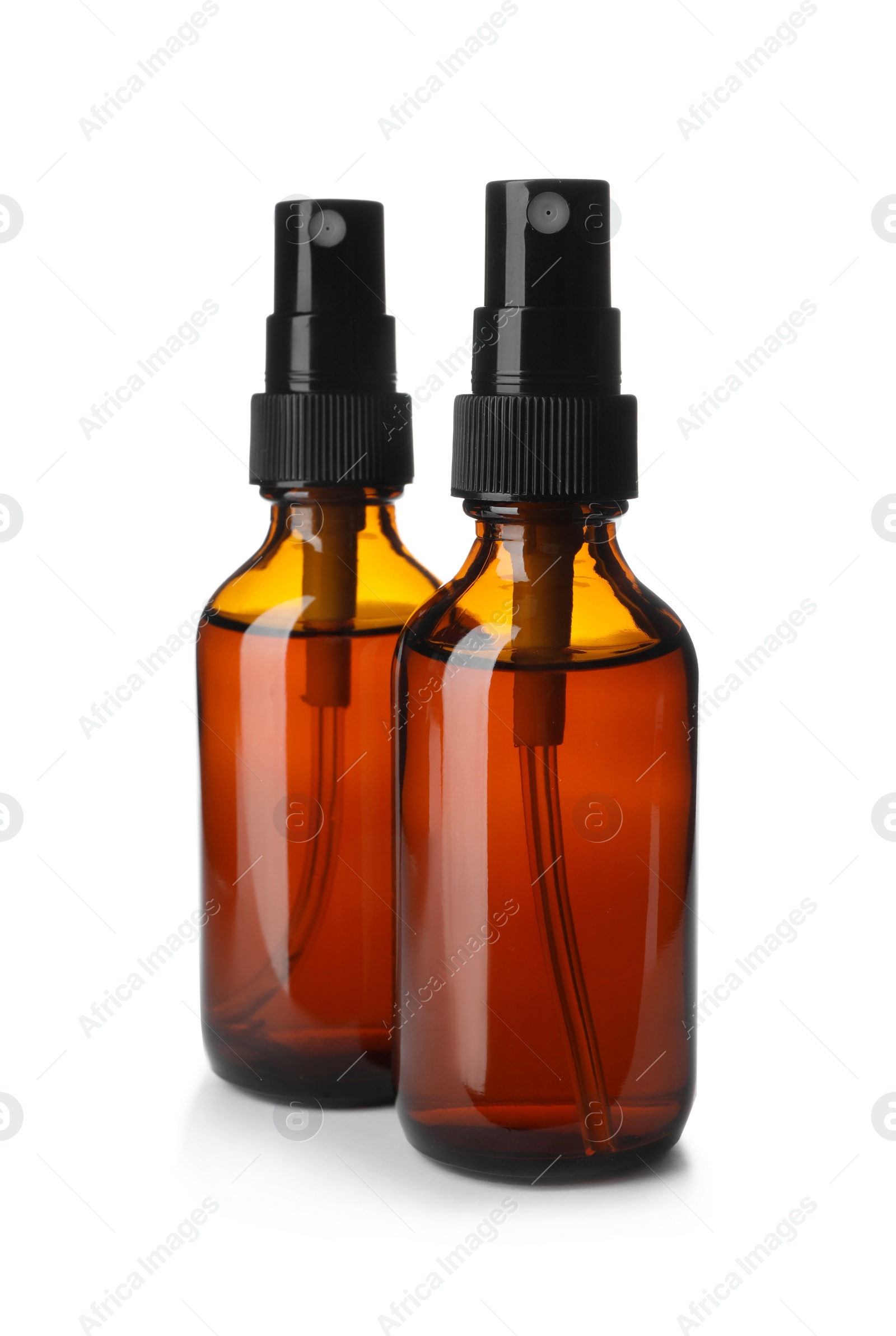 Photo of Bottles of essential oil isolated on white