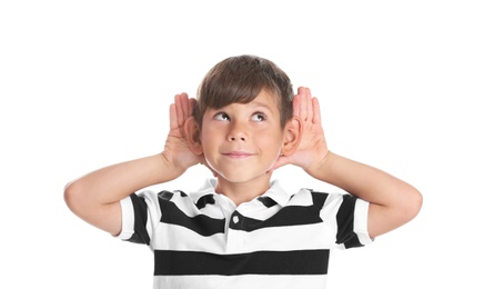 Cute little boy with hearing problem on white background