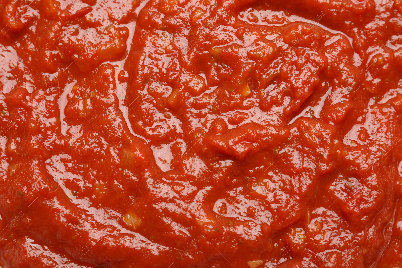 Photo of Homemade tomato sauce as background, top view