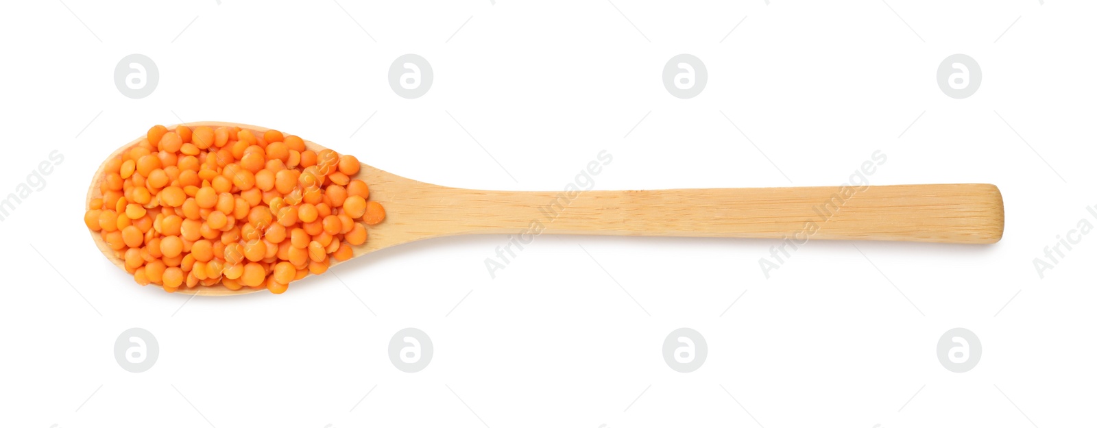 Photo of Wooden spoon with raw lentils isolated on white, top view