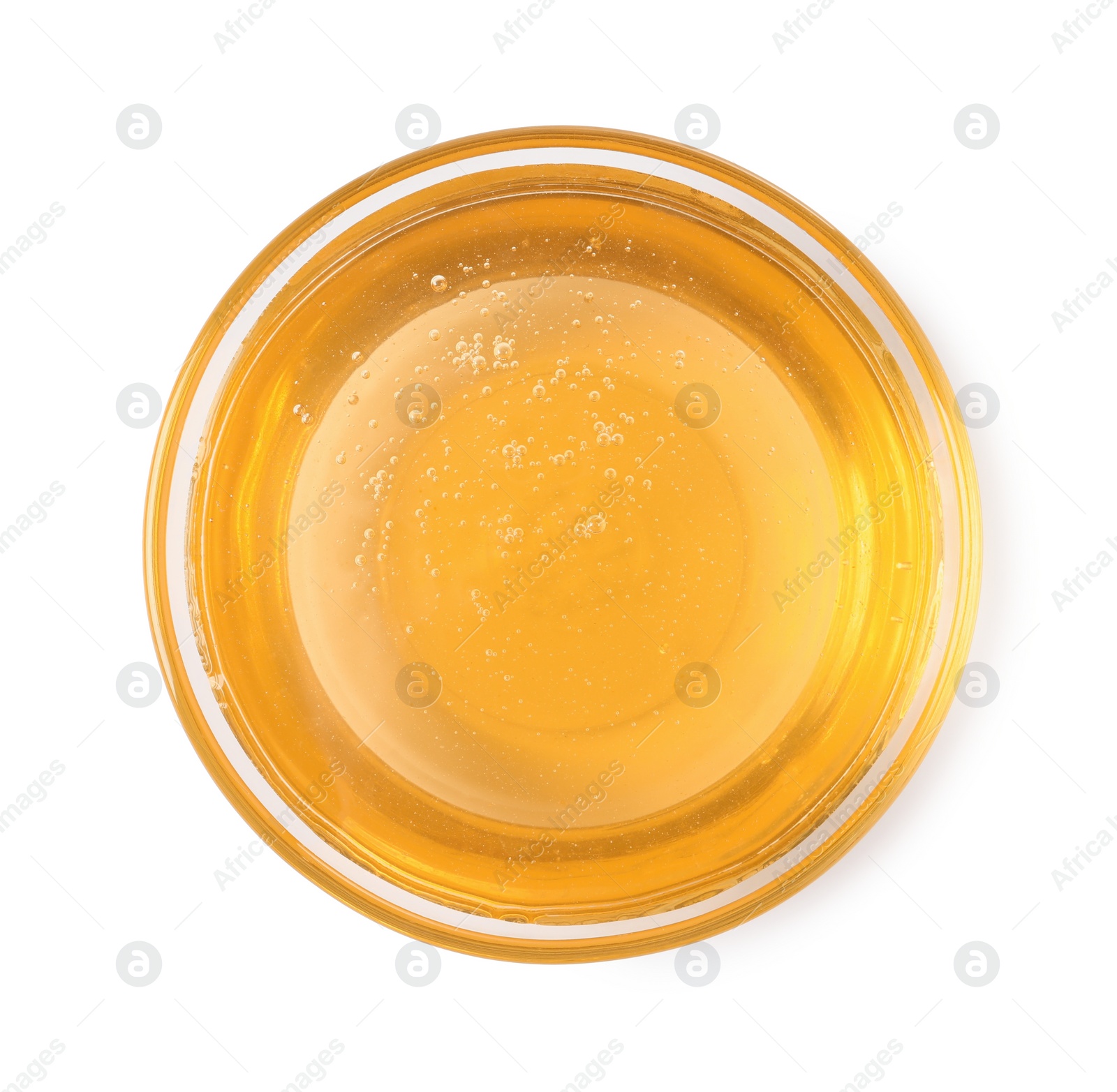 Photo of Tasty honey in bowl isolated on white, top view