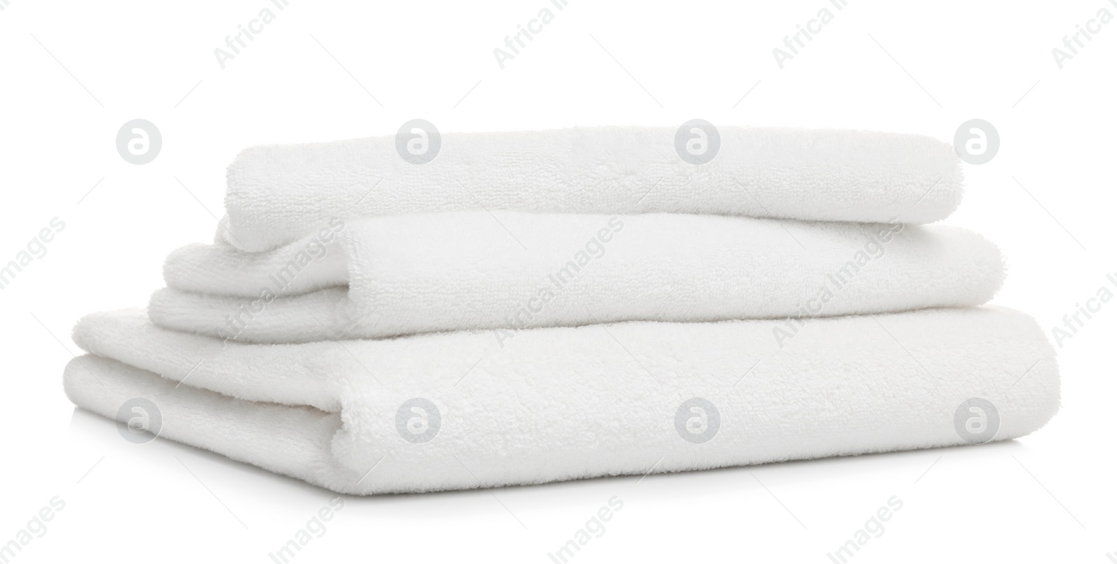 Photo of Stack of clean folded towels on white background