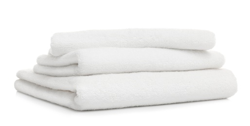 Photo of Stack of clean folded towels on white background