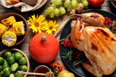 Photo of Flat lay composition with turkey on wooden background. Happy Thanksgiving day