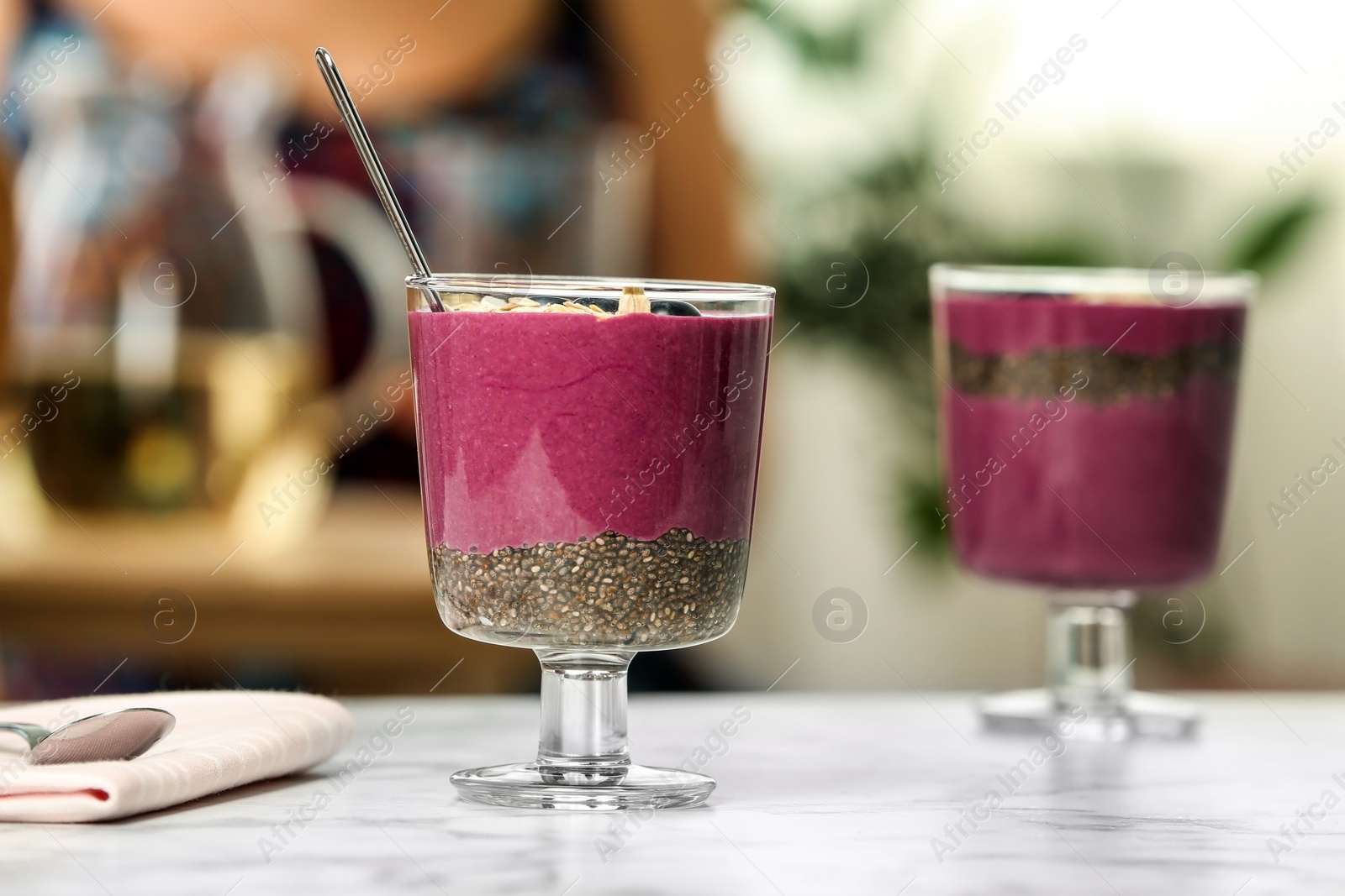 Photo of Glasses with tasty acai smoothie on table