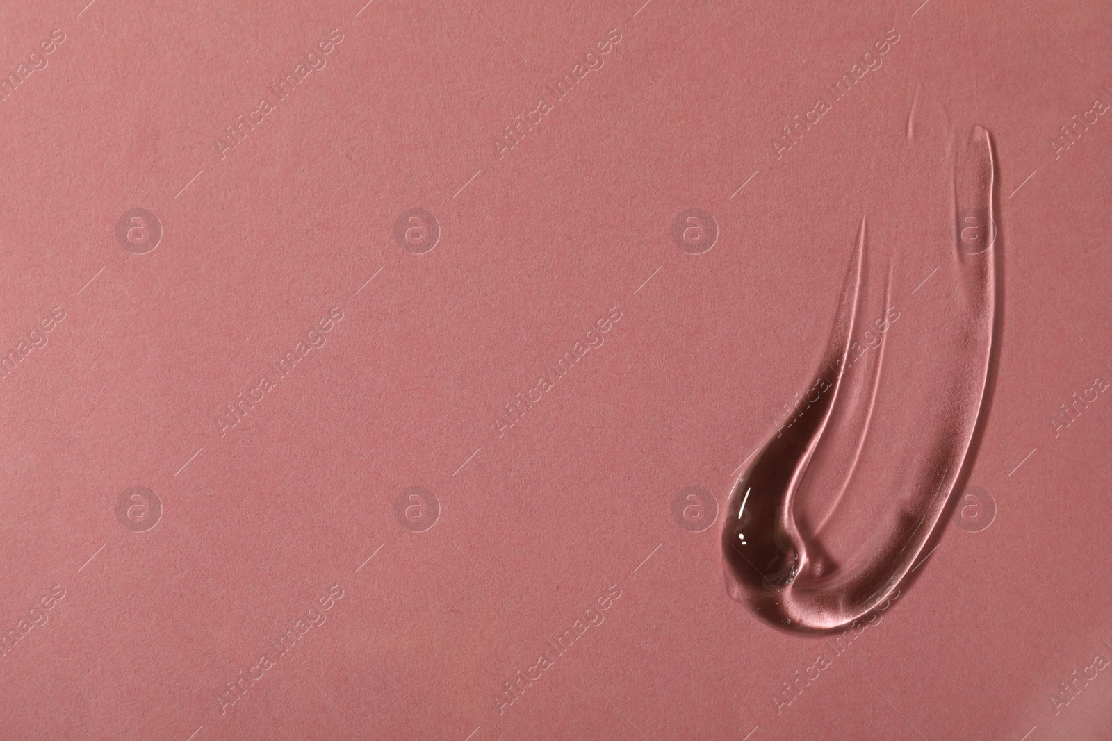 Photo of Sample of cosmetic gel on pink background, top view. Space for text