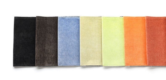 Fabric samples of different colors for interior design on white background