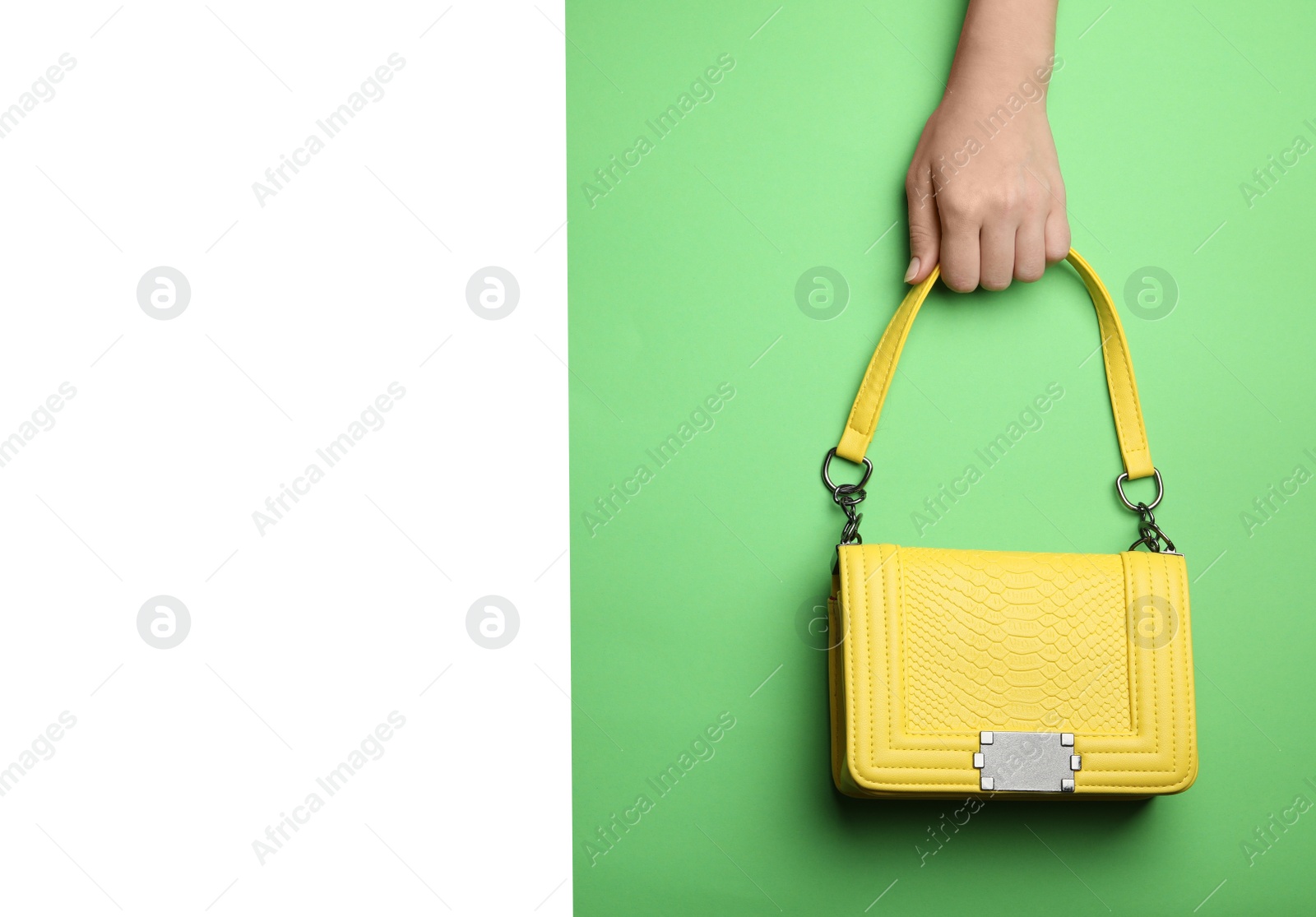 Photo of Woman holding small bag on color background, top view. Space for text
