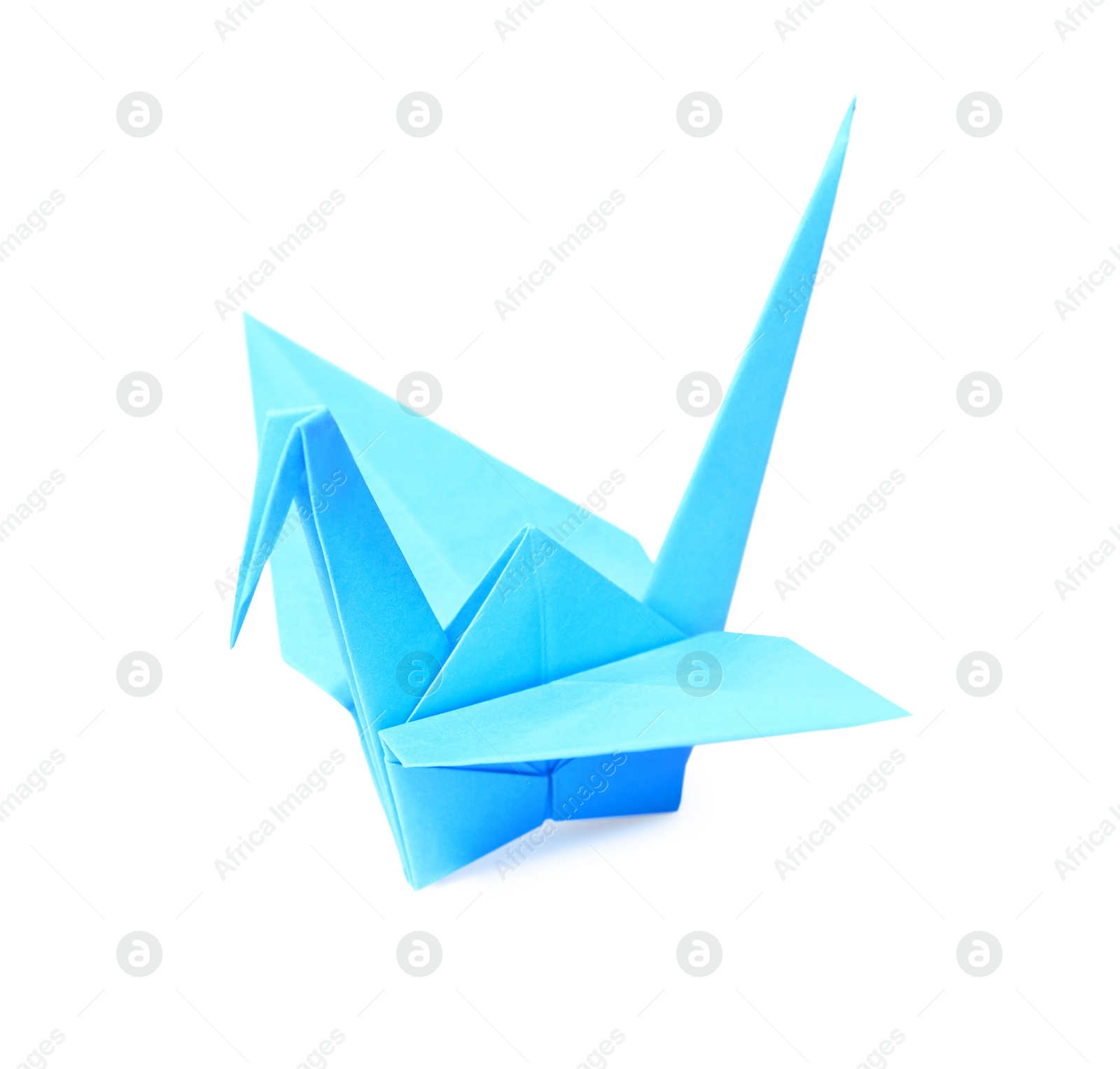 Photo of Origami art. Blue handmade paper crane isolated on white