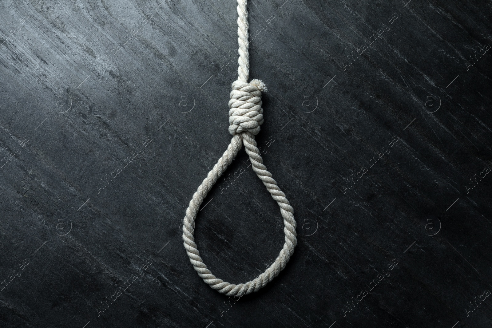 Photo of Rope noose on black table, top view