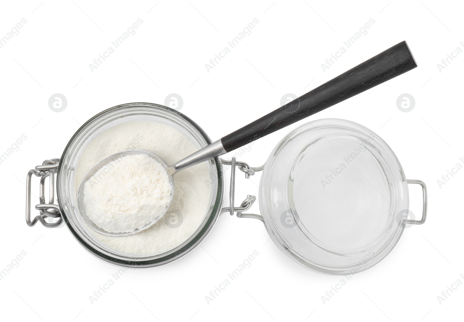 Photo of Baking powder in glass jar and spoon isolated on white, top view