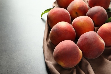 Photo of Fresh sweet peaches on table, closeup