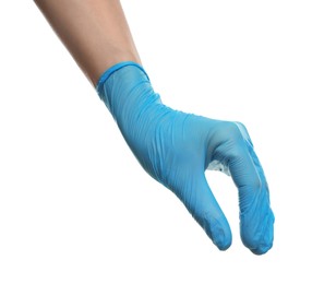 Doctor wearing light blue medical glove holding something on white background, closeup