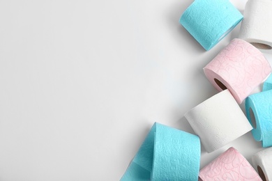 Rolls of toilet paper on white background, top view. Space for text
