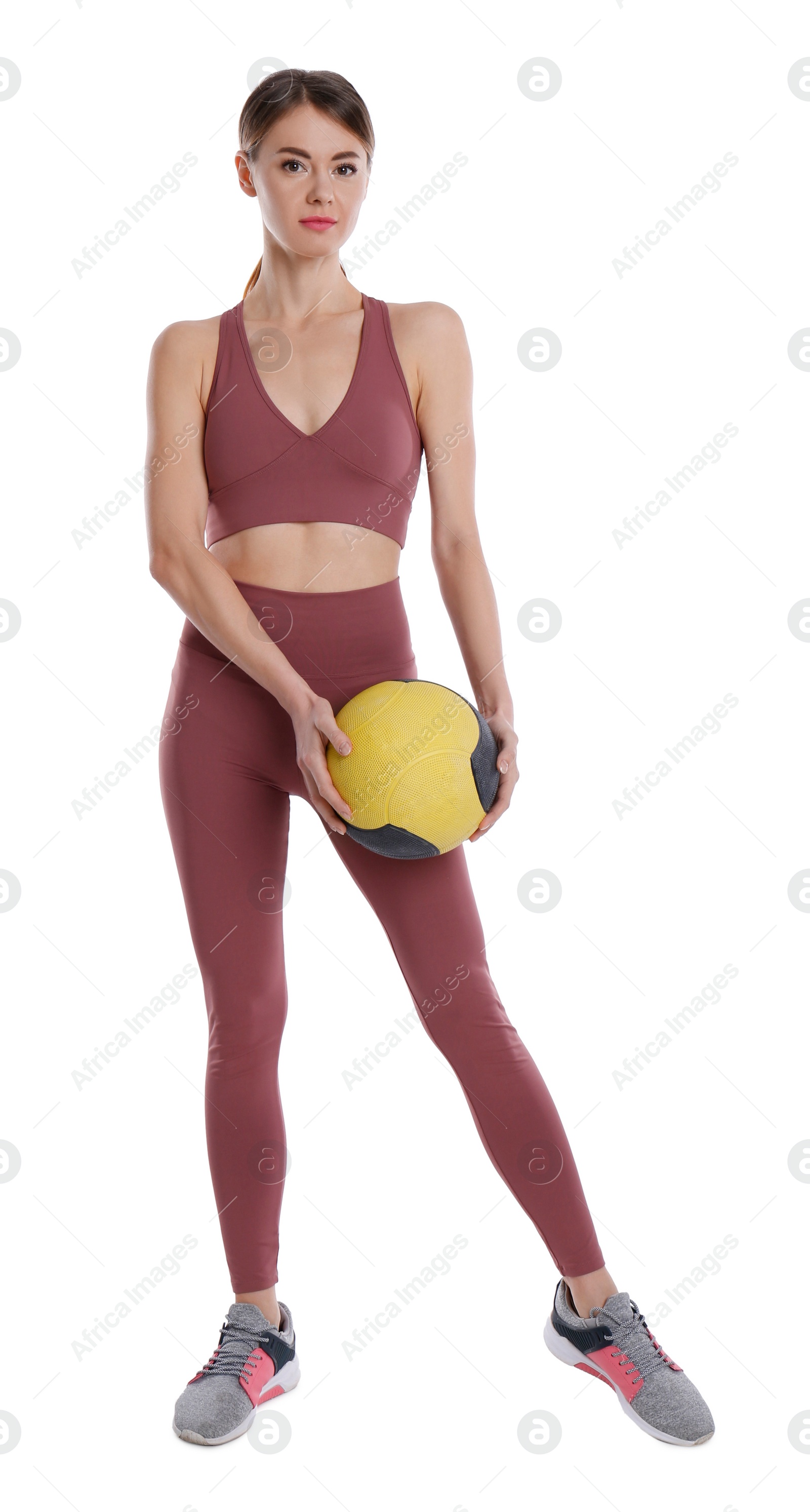 Photo of Athletic woman with medicine ball isolated on white