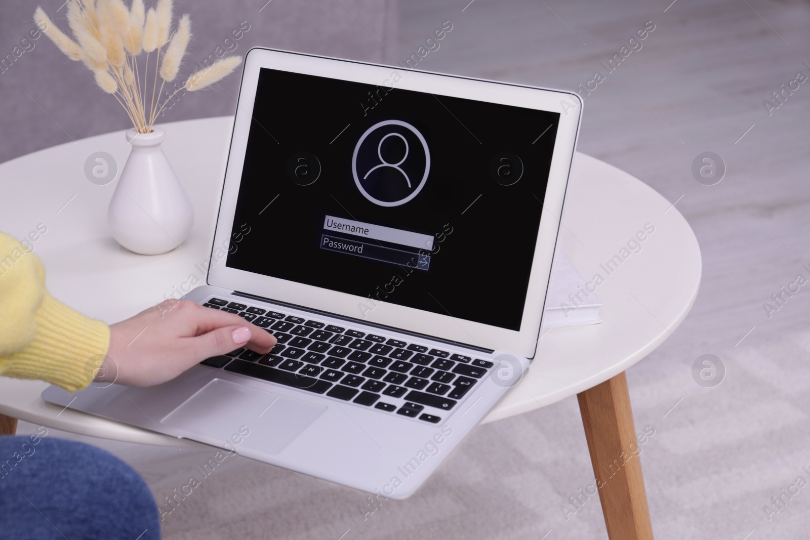 Photo of Woman unlocking laptop with blocked screen indoors, closeup