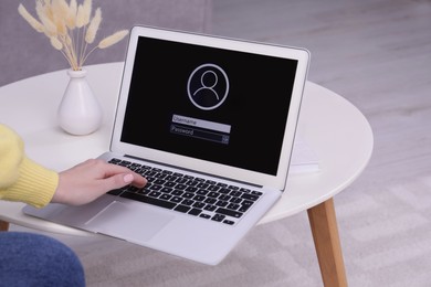 Woman unlocking laptop with blocked screen indoors, closeup