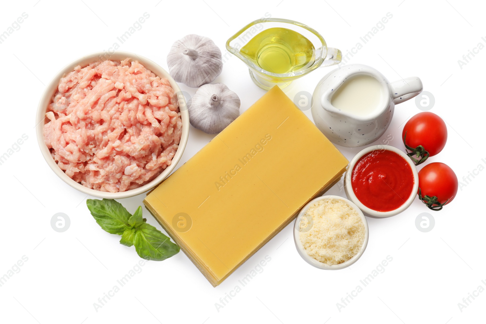 Photo of Uncooked ingredients for lasagna isolated on white