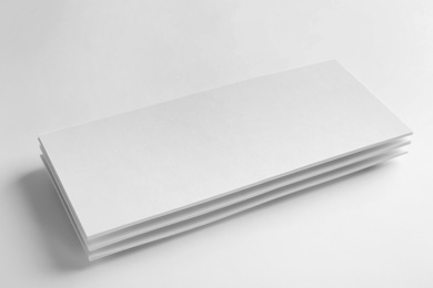 Photo of Blank palm cards on white background. Mock up for design