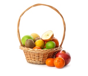 Basket with fresh tropical fruits on white background