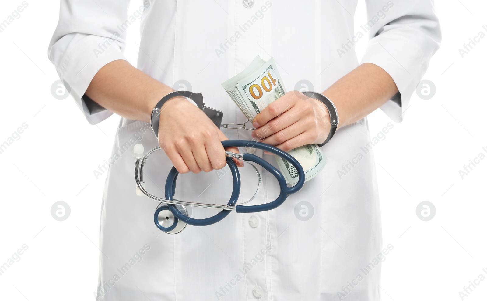 Photo of Doctor in handcuffs with bribe and stethoscope on white background, closeup. Corrupted medicine