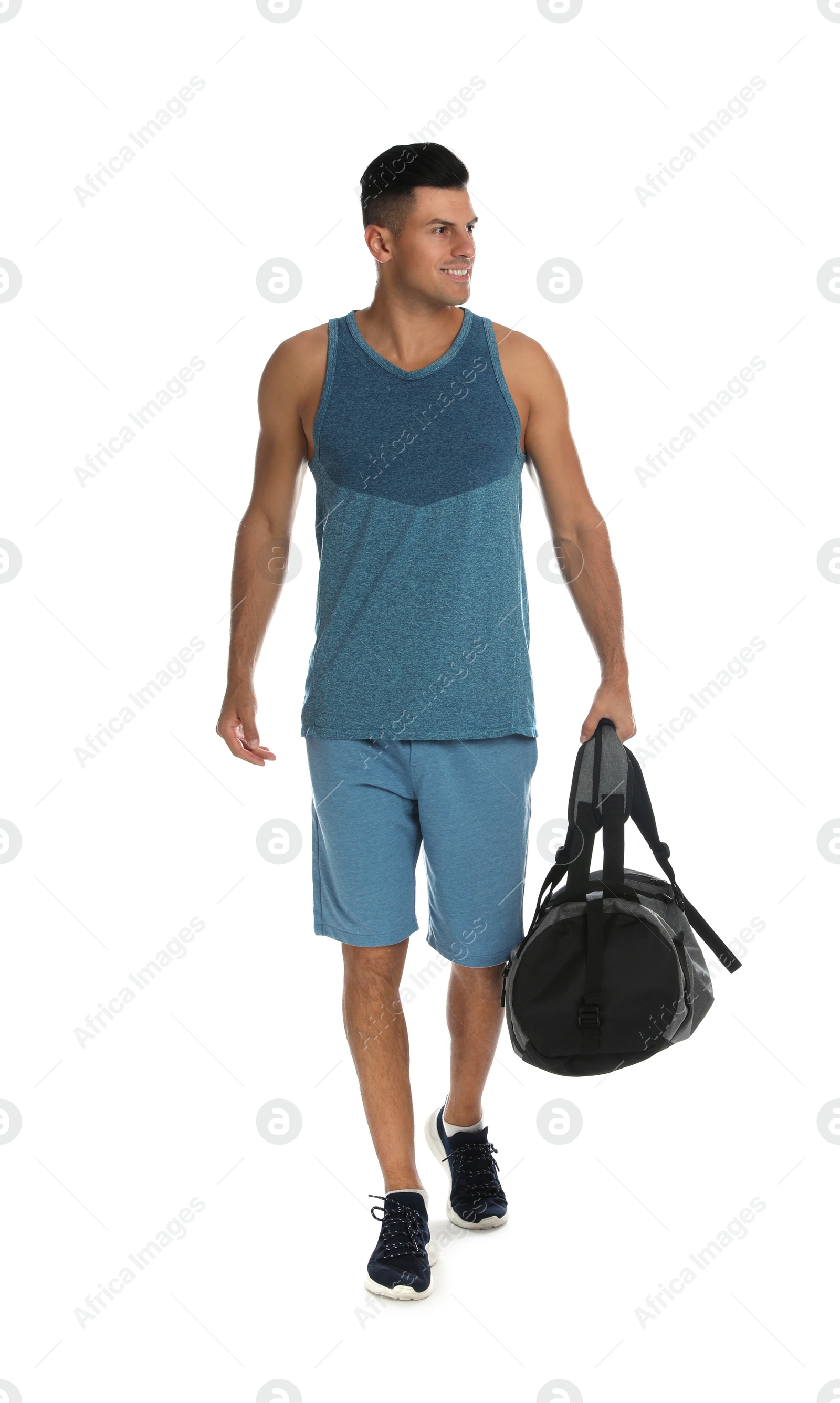 Photo of Handsome man with sports bag on white background