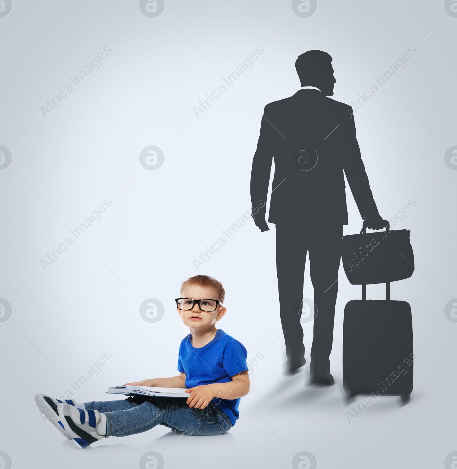 Image of Little boy with book dreaming to be businessman. Silhouette of man behind kid's back