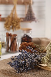 Photo of Aromatic dry lavender flowers on table indoors