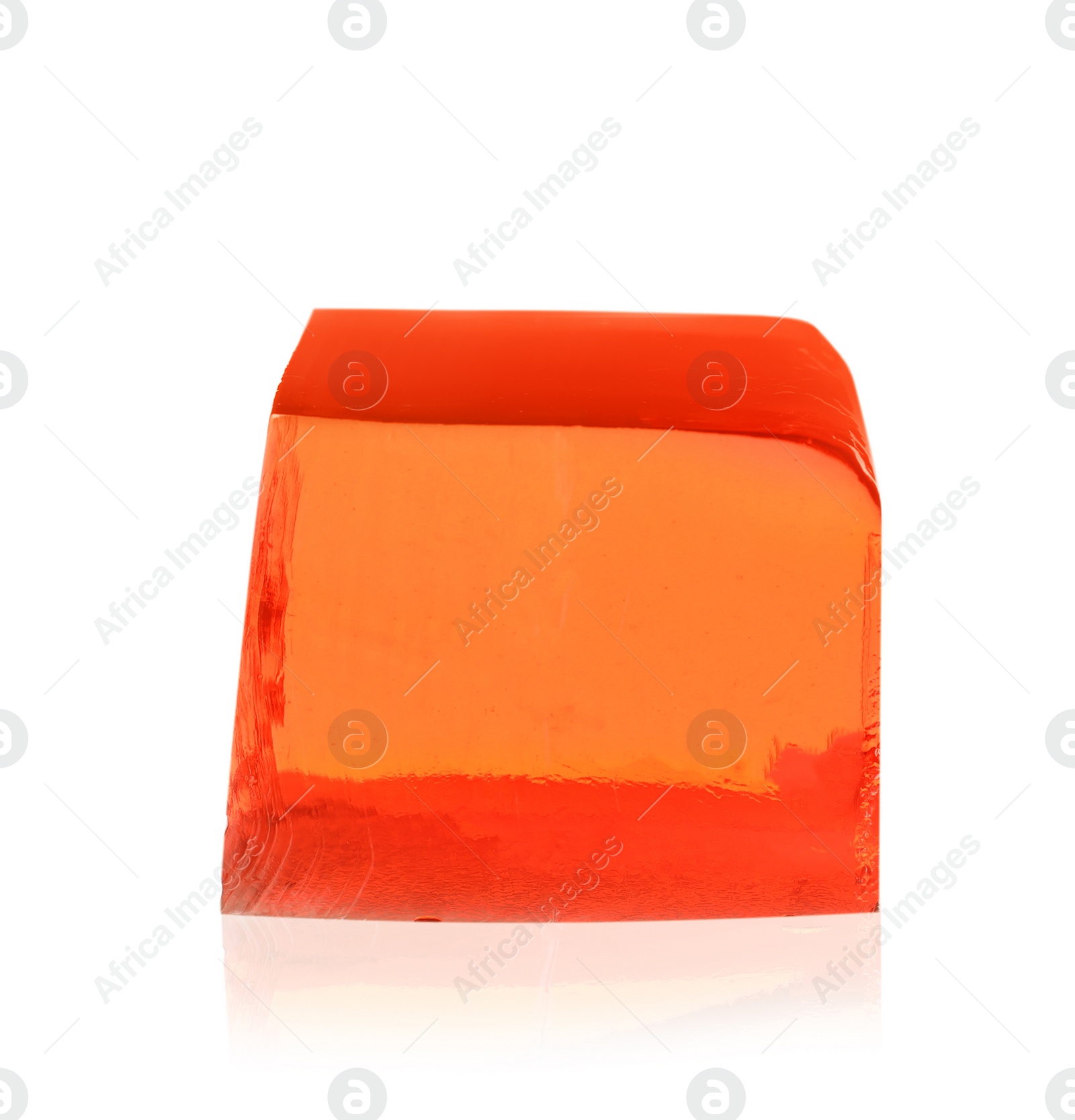 Photo of Delicious red jelly cube on white background