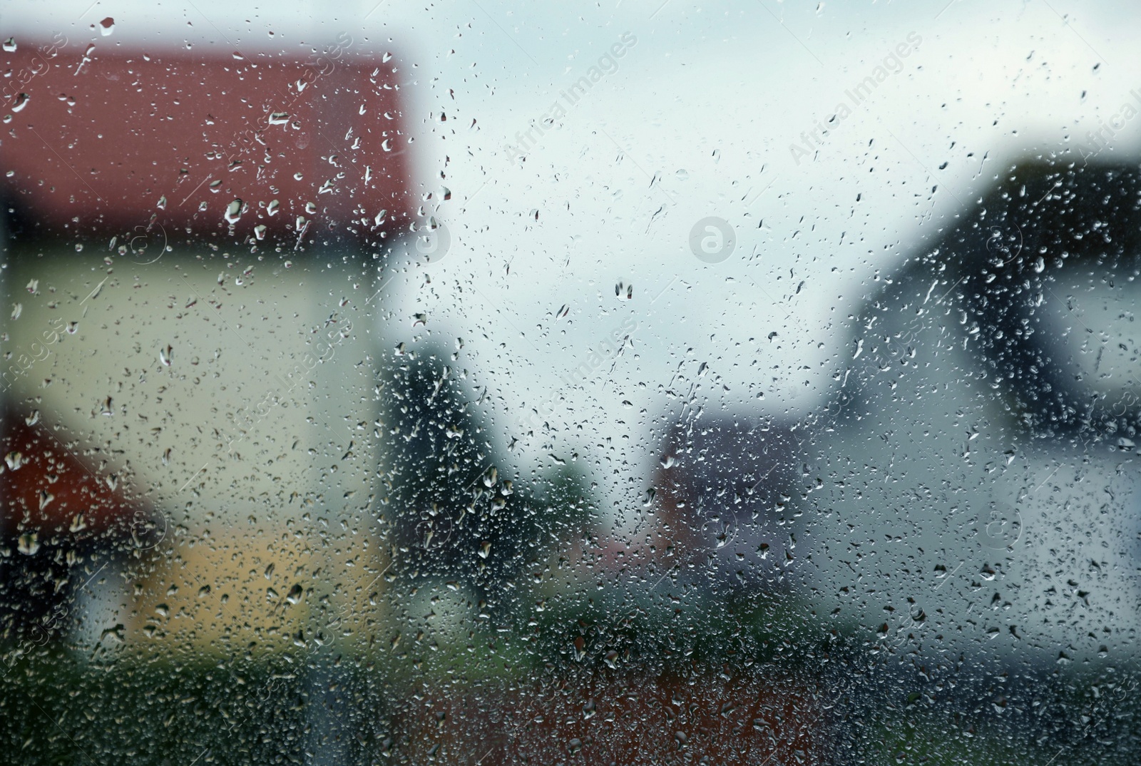 Photo of Window glass with water drops, closeup. Rainy weather