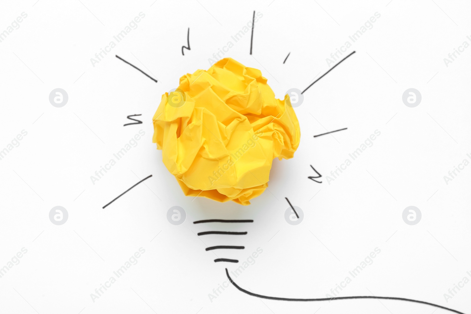 Photo of Creative composition with paper ball as lightbulb on white background, top view. Idea concept