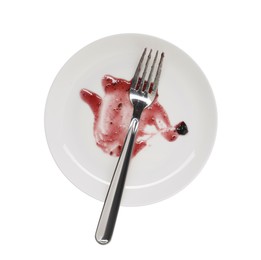 Dirty plate and fork on white background, top view