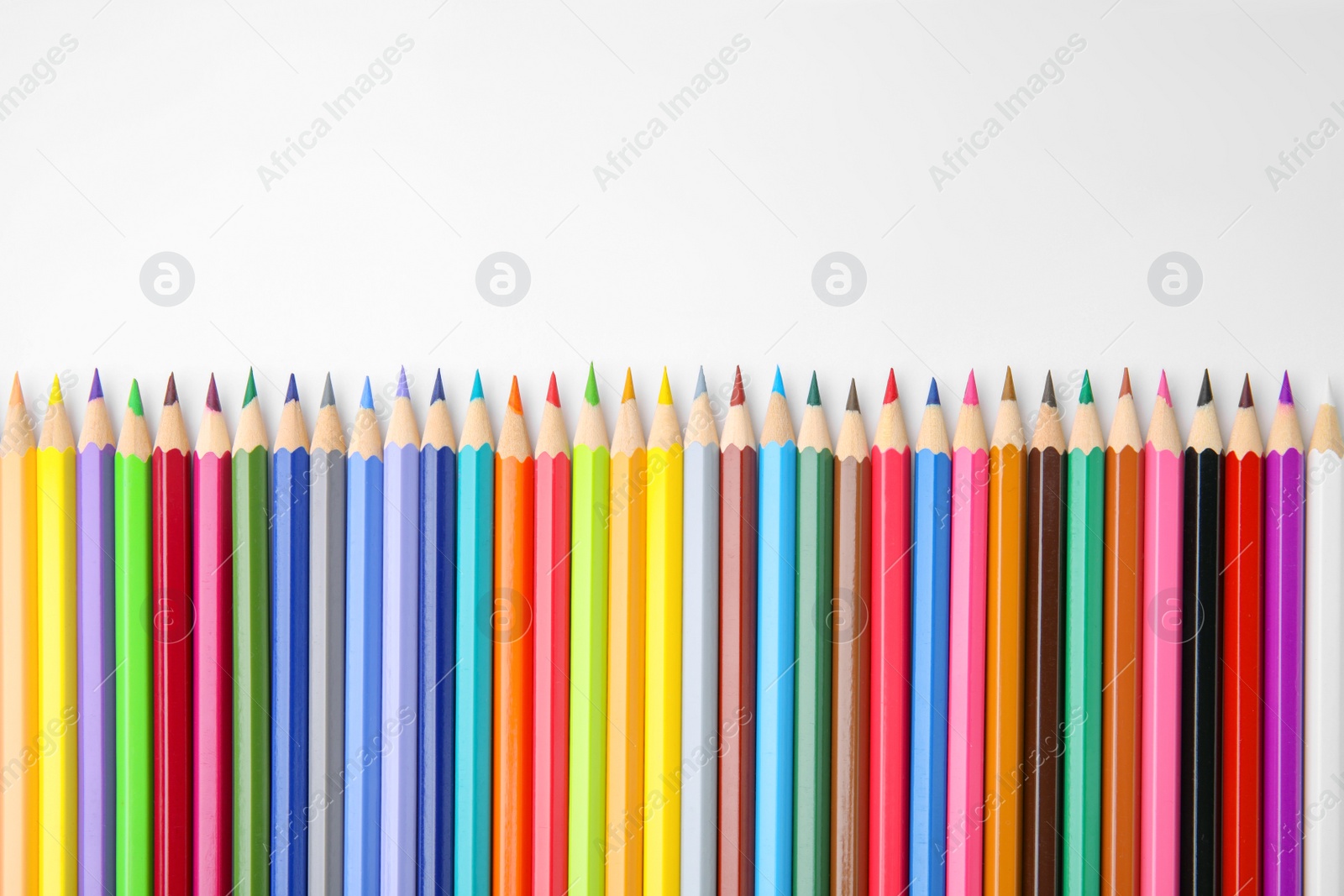 Photo of Many colorful wooden pencils on white background, flat lay. Space for text