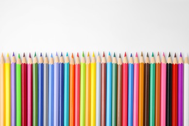 Photo of Many colorful wooden pencils on white background, flat lay. Space for text