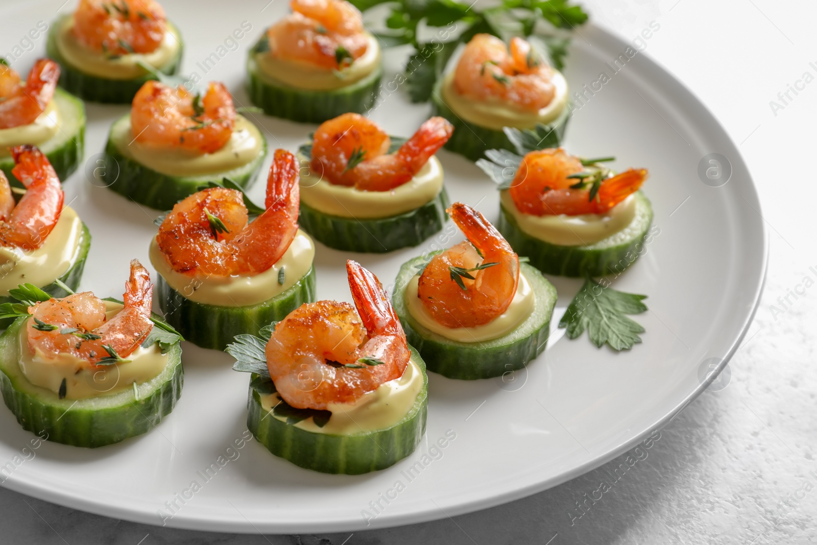 Photo of Delicious snacks with shrimp on plate