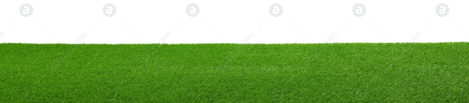 Photo of Green artificial grass surface isolated on white