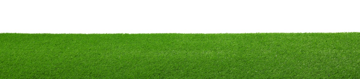 Photo of Green artificial grass surface isolated on white