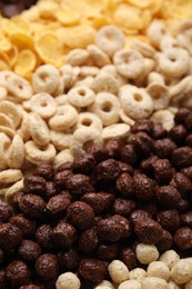 Photo of Different types of breakfast cereals as background, closeup