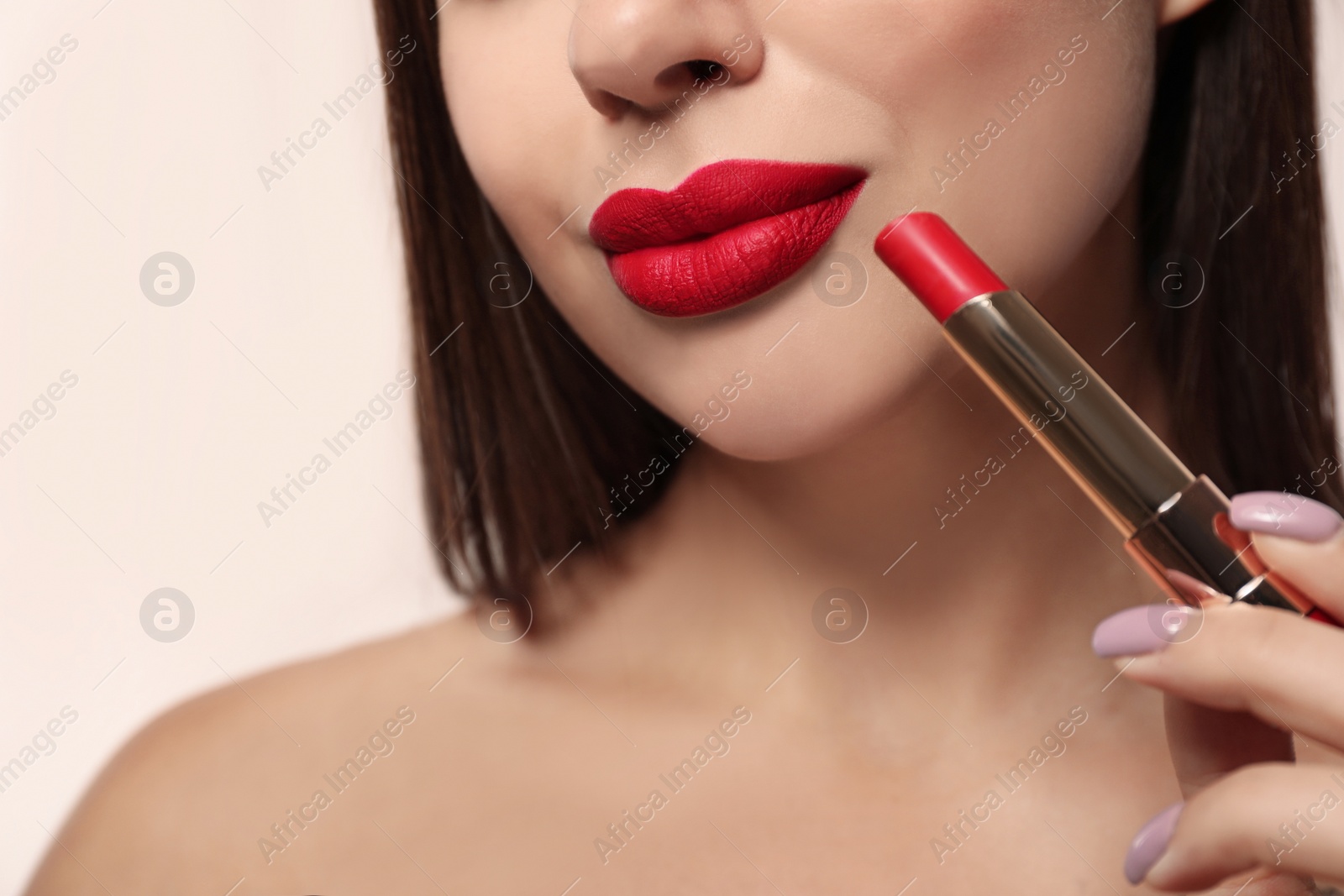 Photo of Woman with red lipstick on light background, closeup