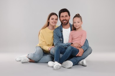 Photo of Portrait of happy family on light grey background